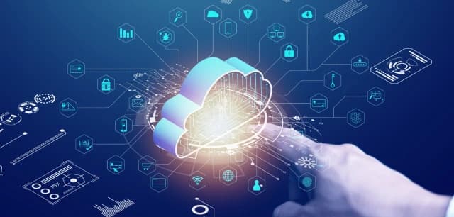 Hand pointing at a cloud icon symbolizing cloud computing and integration with digital technologies