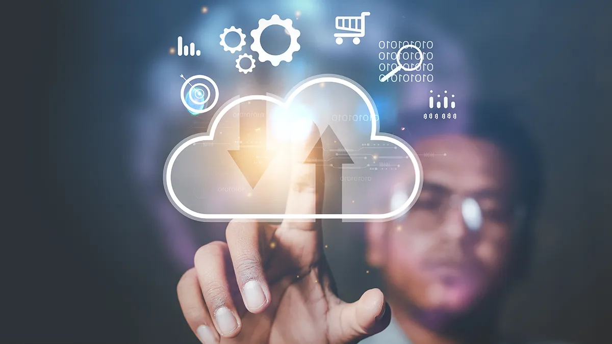 A hand interacts with a digital interface by touching a cloud icon surrounded by data analytics symbols, settings gears, and network connectivity. This image visually represents the complexities and nuances of understanding public cloud in 2023, which aligns with the blog article “How to Properly Understand Public Cloud in 2023? And Why Is It So Difficult?”