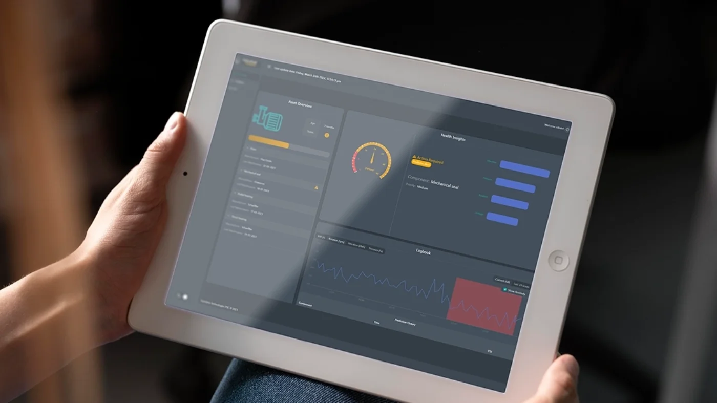 Hand holding a magnifying glass over financial charts, symbolizing data analysis