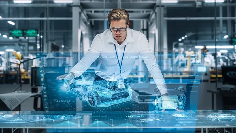 Engineer analyzing a holographic 3D model of a car in a smart factory, representing cloud-based PLM (Product Lifecycle Management) and digital twin technology.