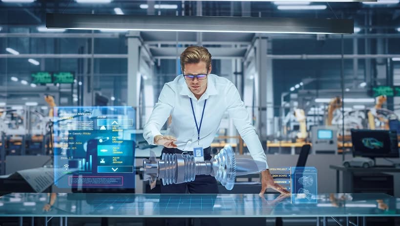 Engineer using augmented reality to design an industrial part in a smart factory